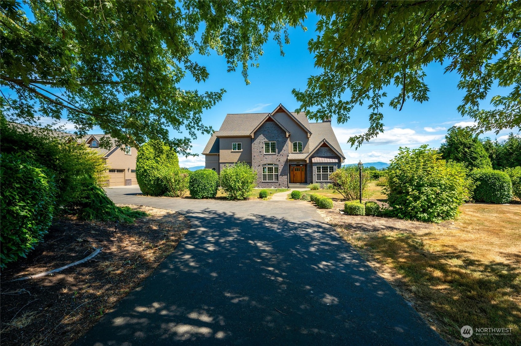 a view of a house with a small yard