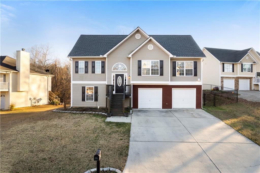 a front view of a house with a yard