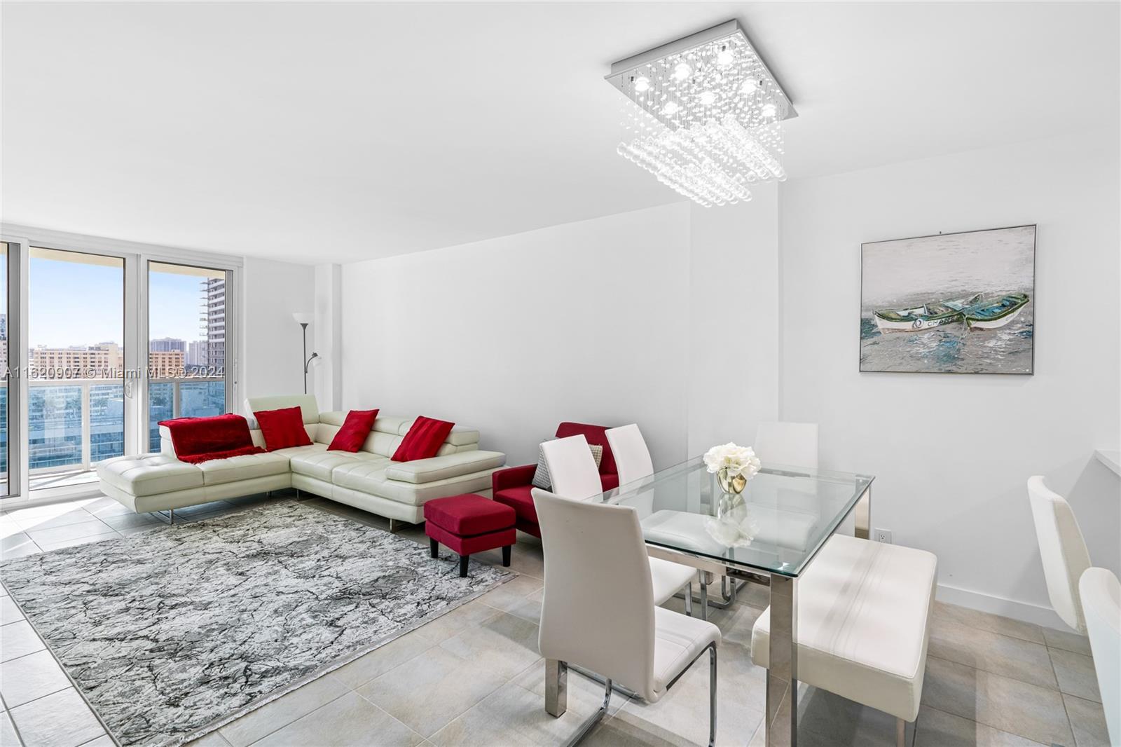 a living room with furniture and a chandelier