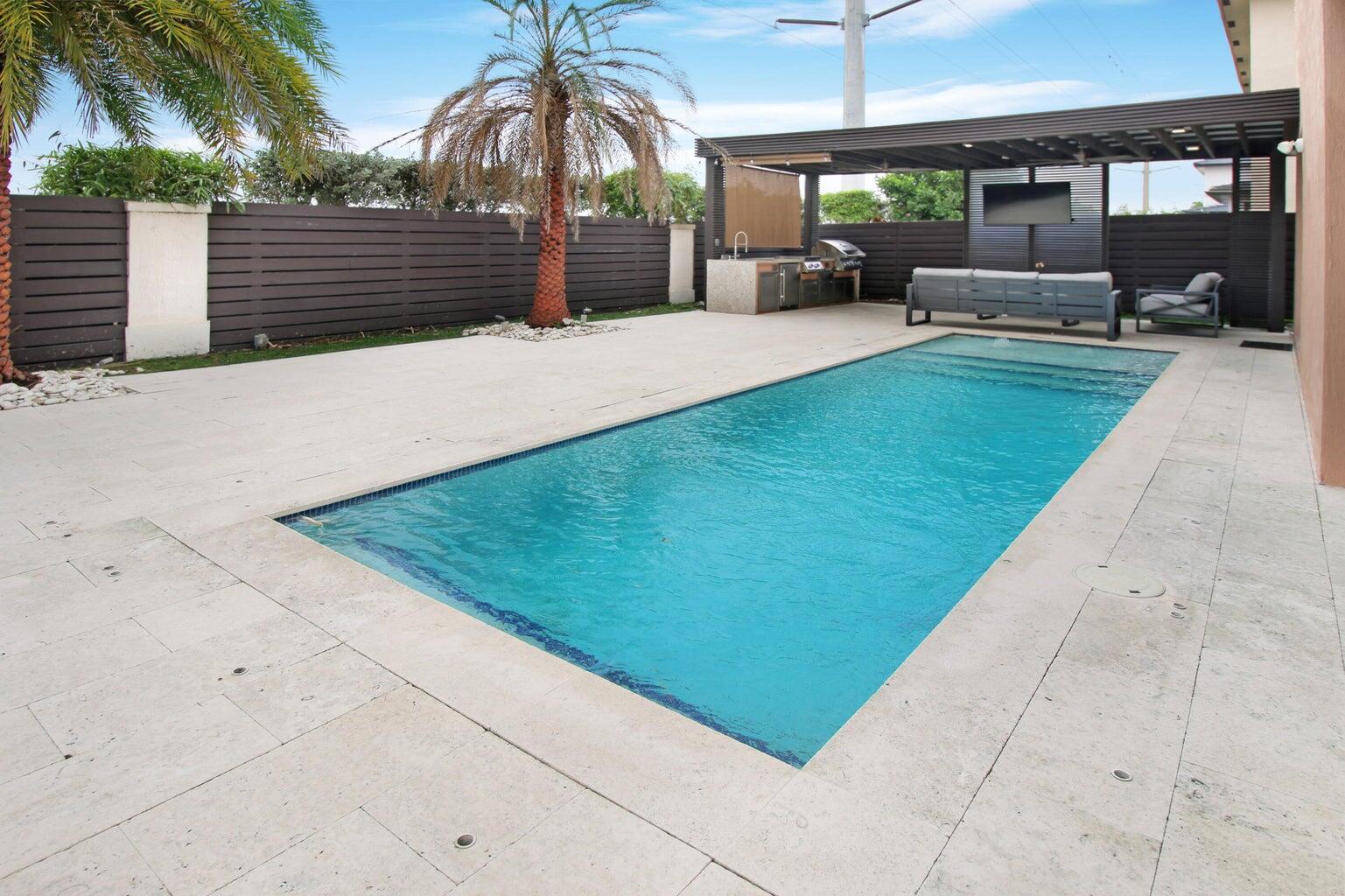 a view of a backyard with sitting area