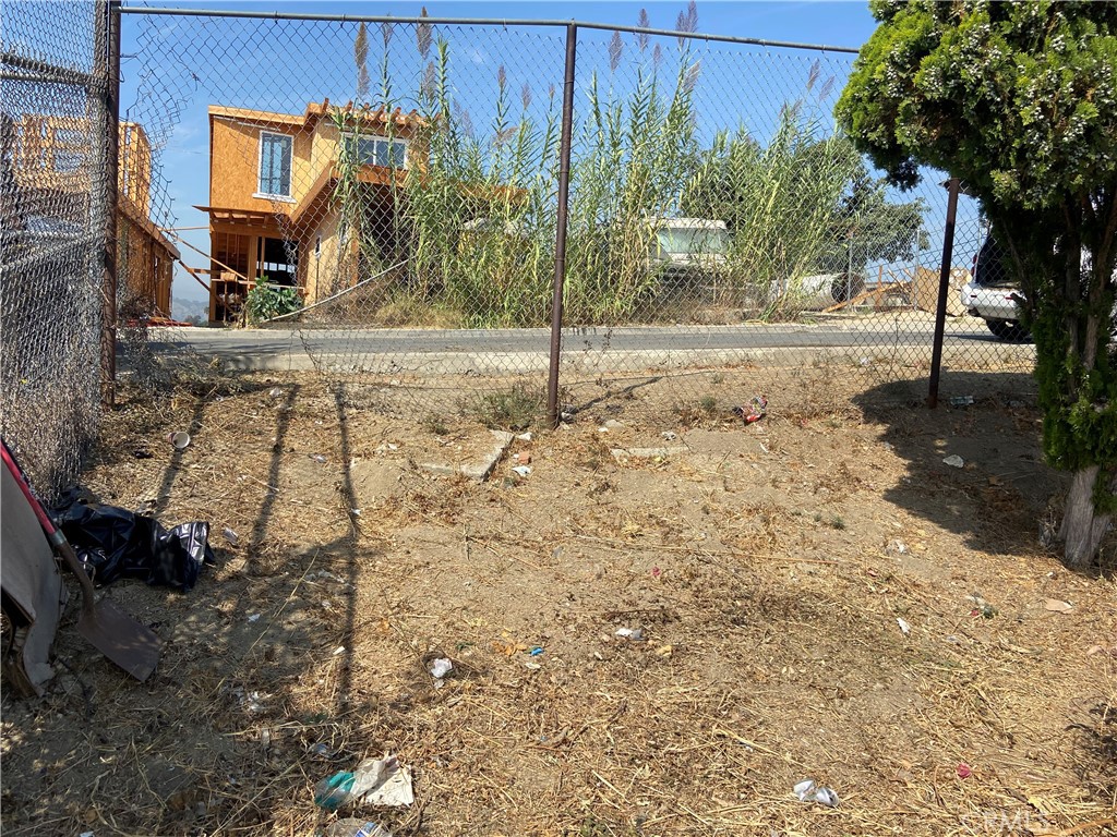 a view of a yard with tree s