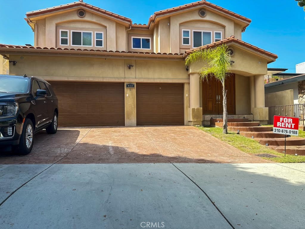 a front view of a house with a garage