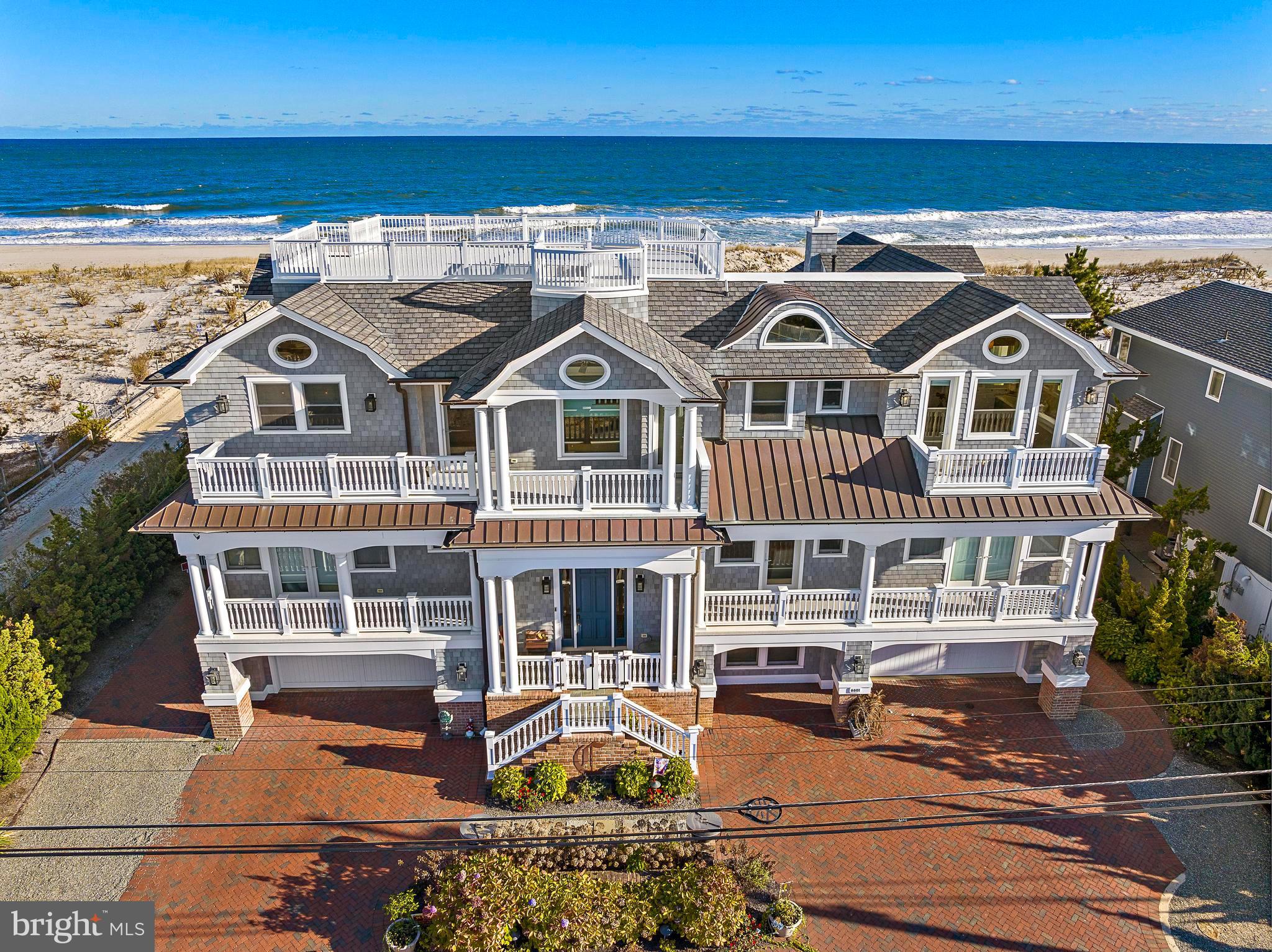 an aerial view of a house with a ocean view