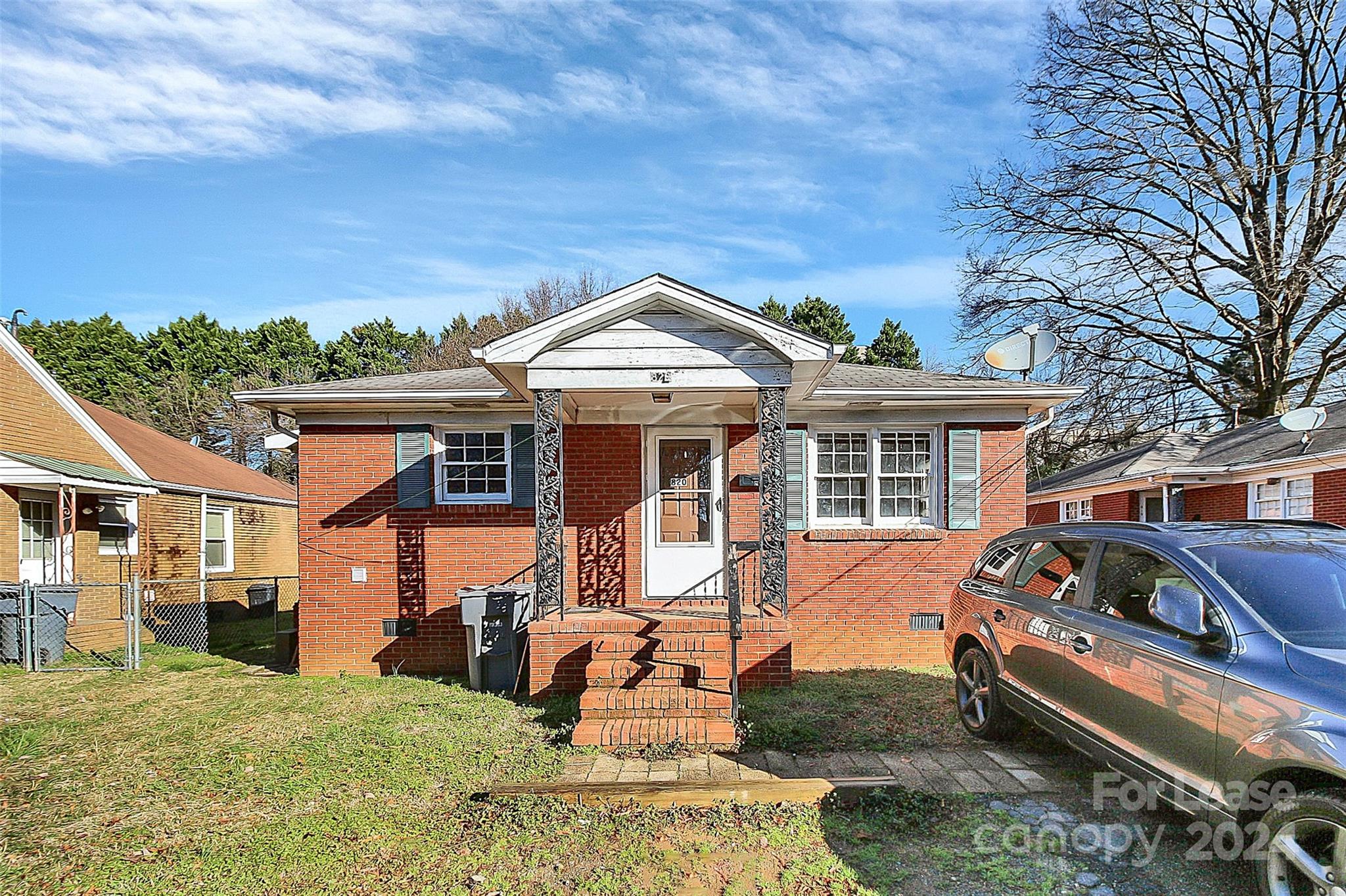 front view of a house with a yard