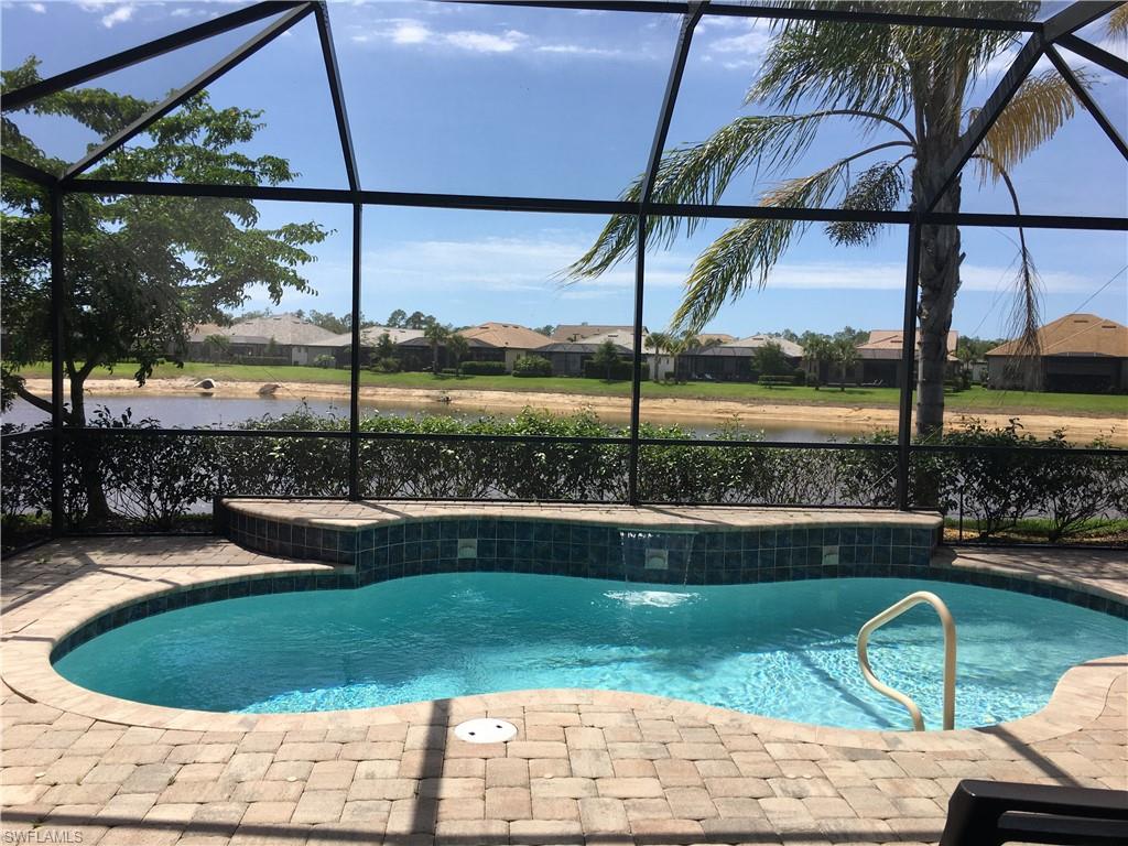 a view of a swimming pool with a back yard