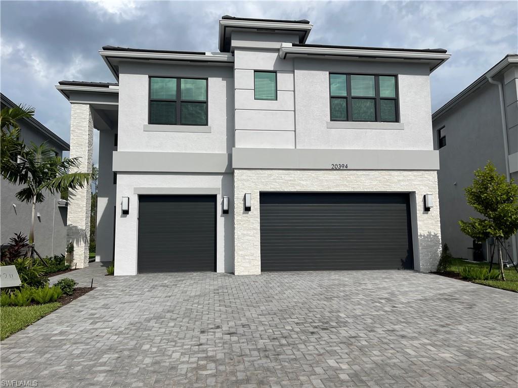 View of front of home featuring a garage