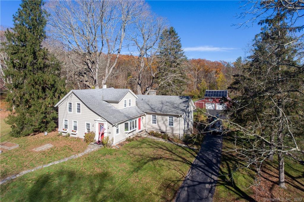 a aerial view of a house with a yard