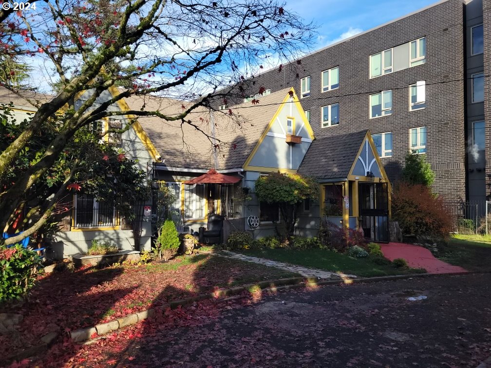 a view of a building with a yard