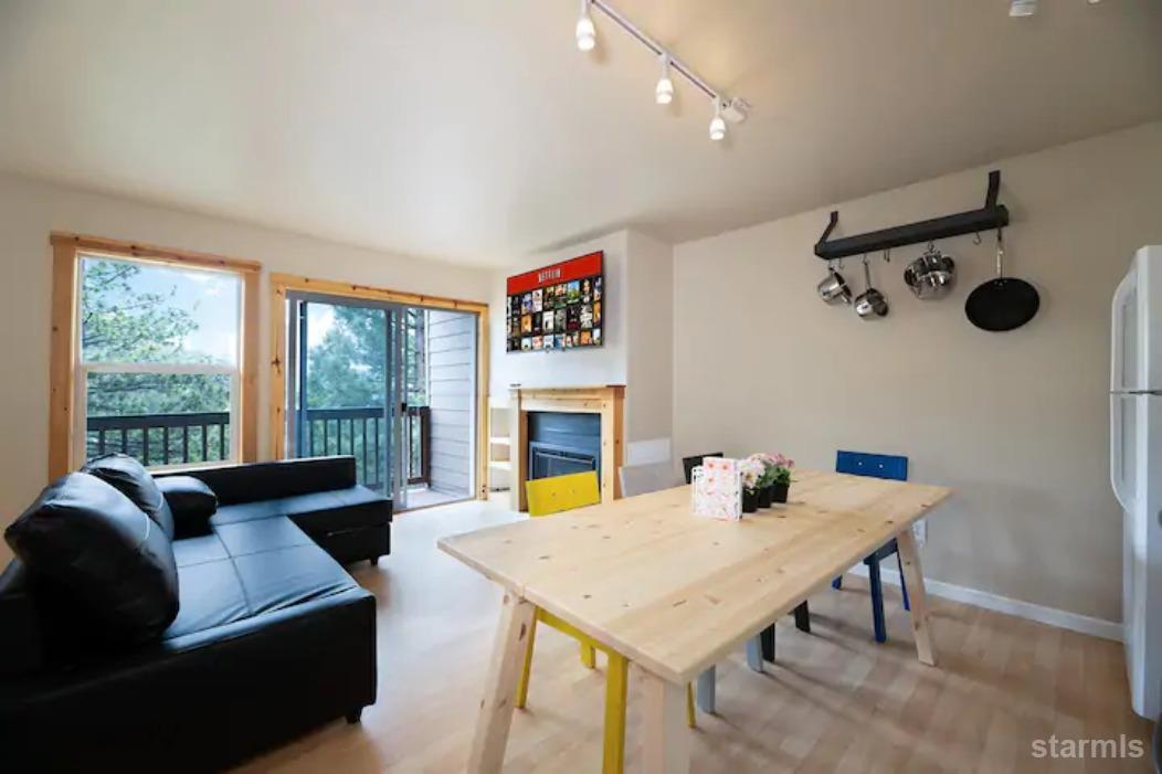 a view of a dining room with furniture window and outside view