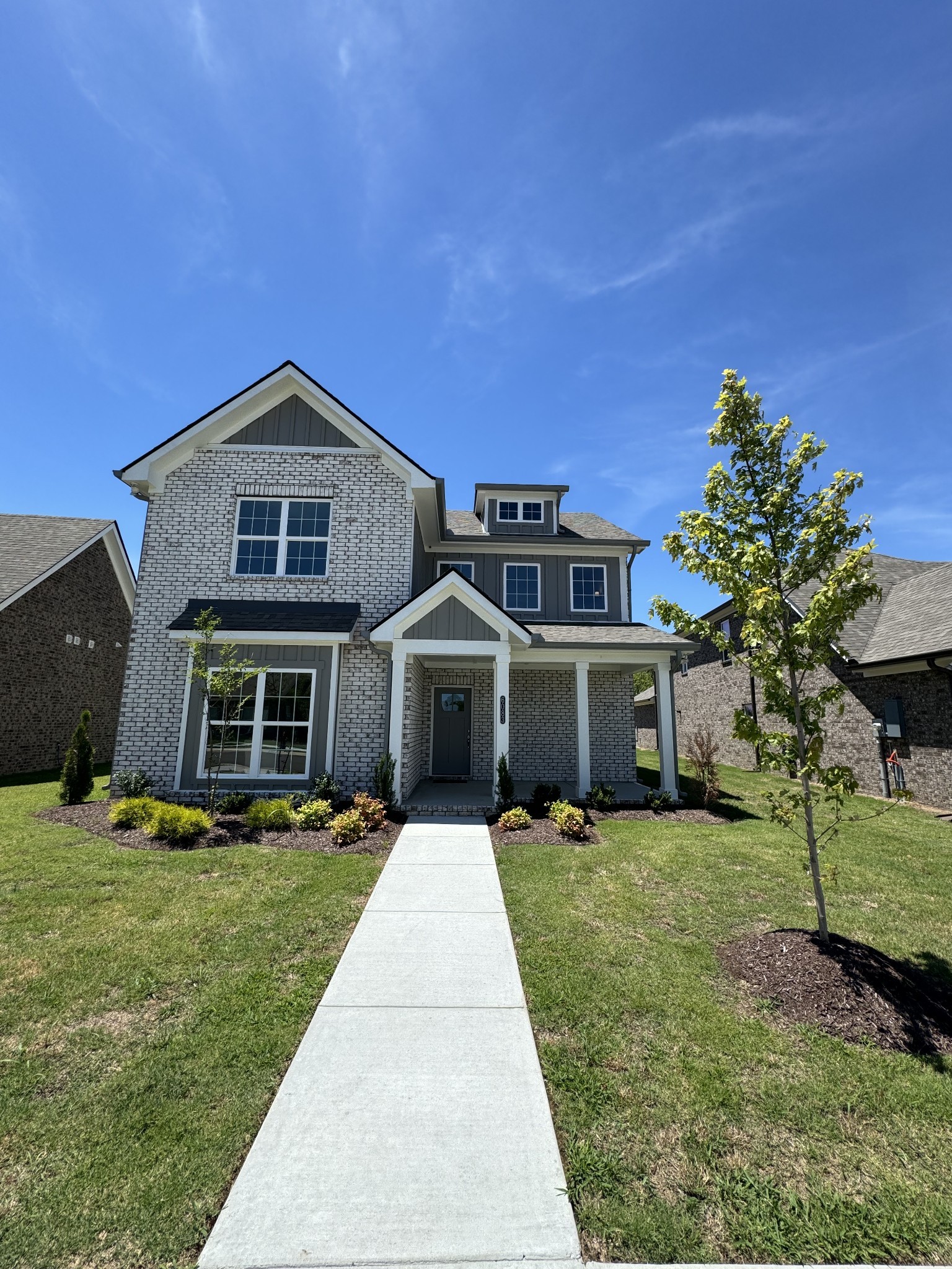 front view of a house with a yard