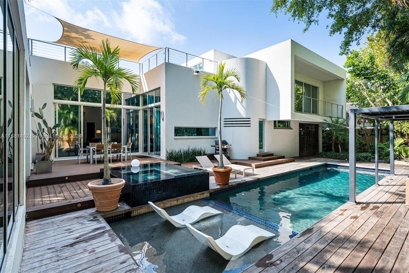 a view of a backyard with couches chair and tables