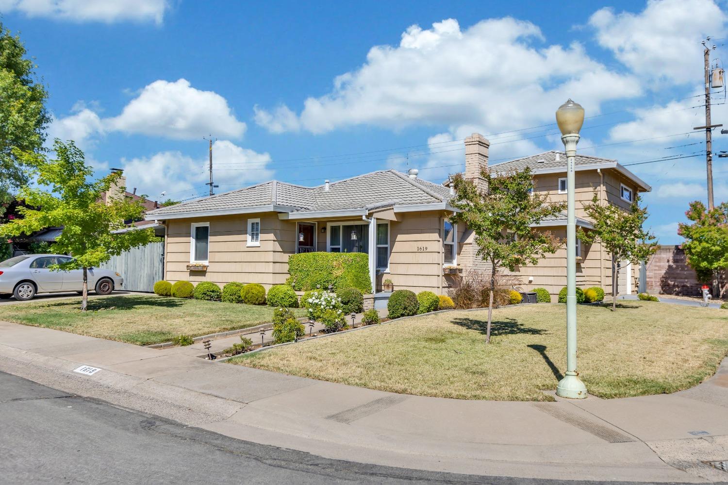 a front view of a house with garden