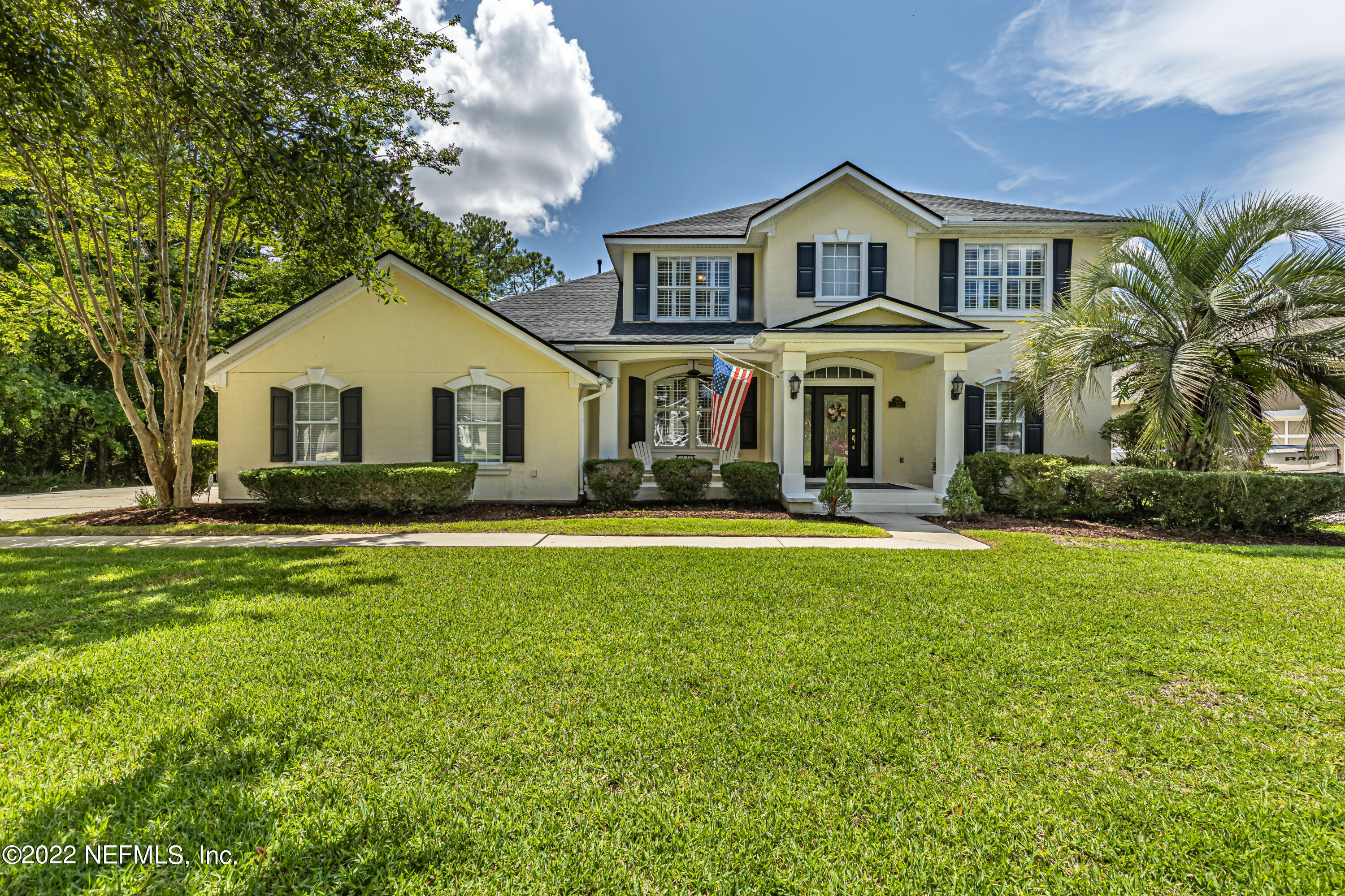 a front view of a house with a yard