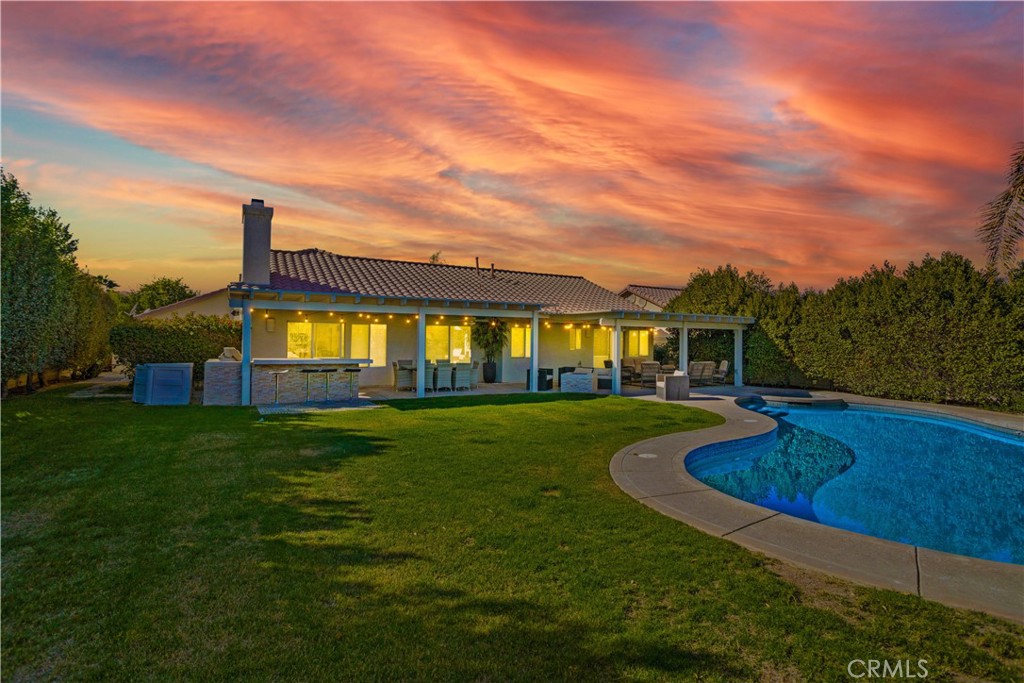 a view of a swimming pool with a garden