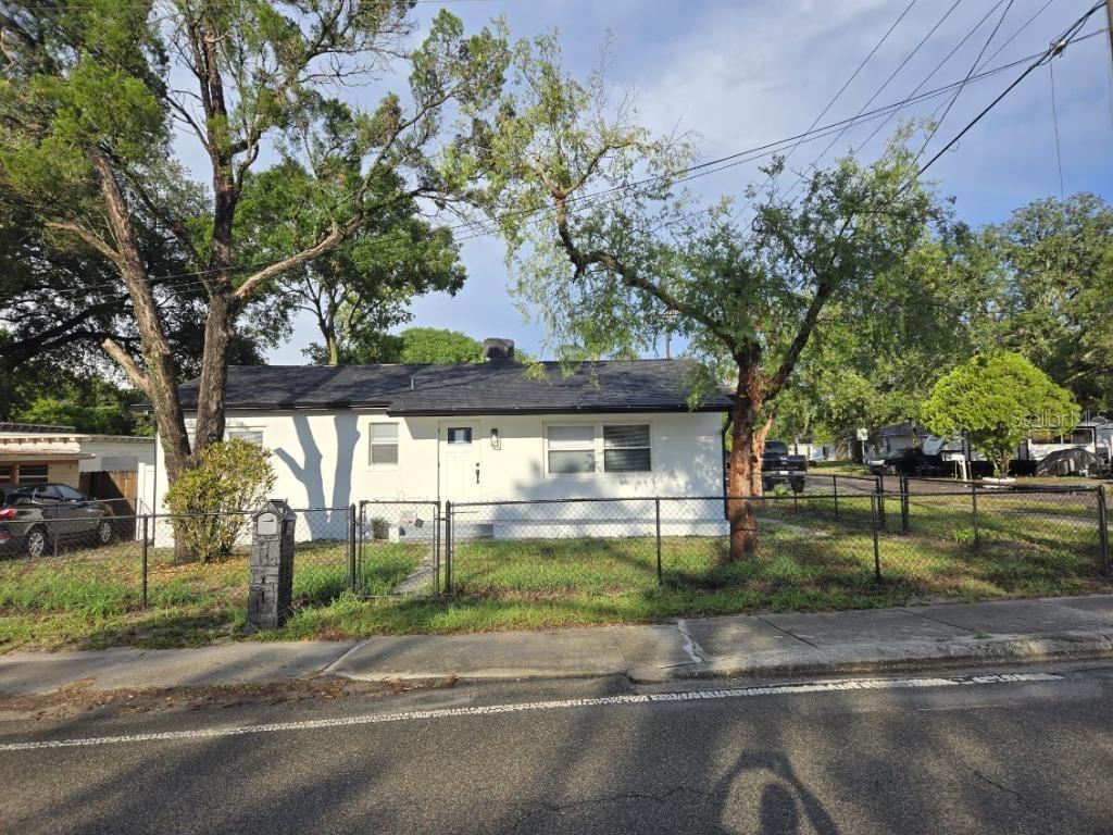 a view of a street in front of a house