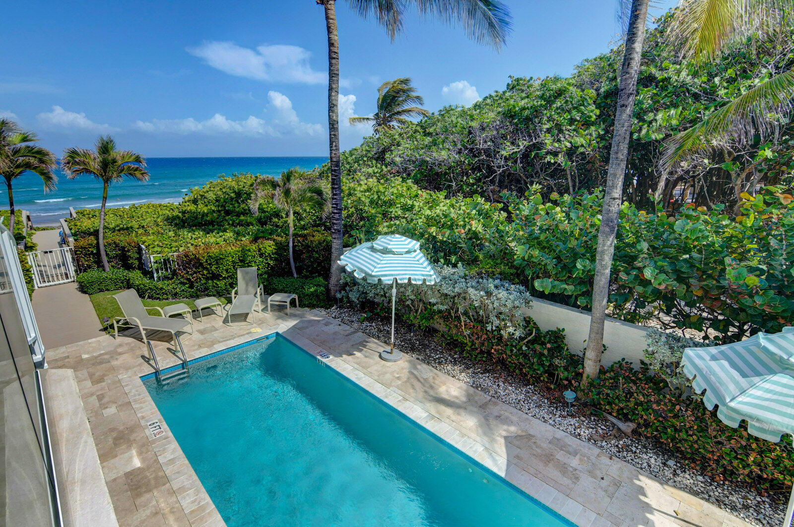 a view of a backyard with sitting area