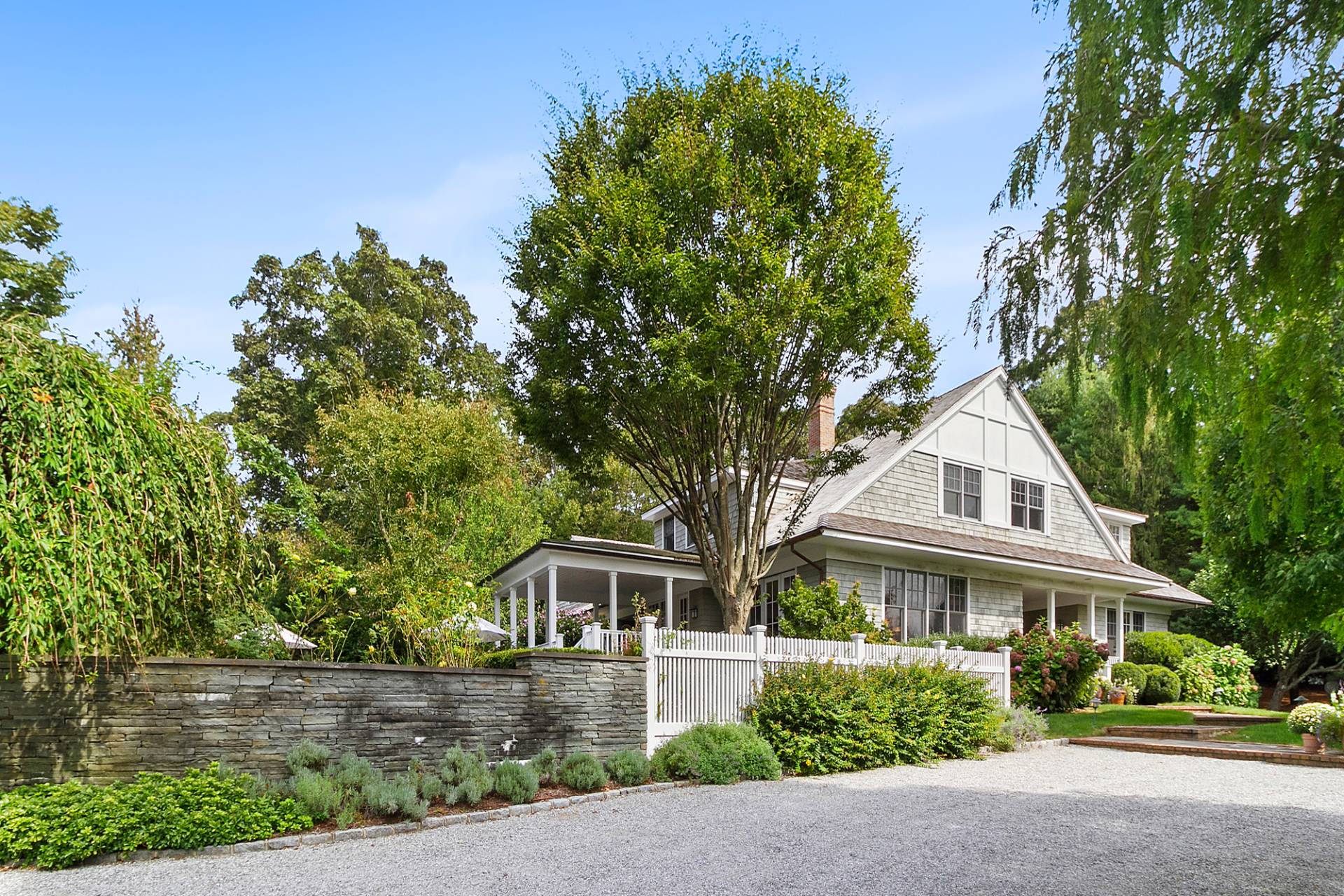 front view of a house with a garden