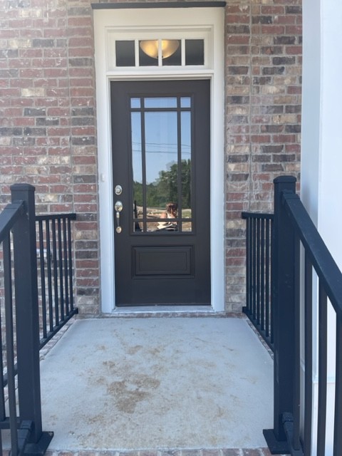 a view of a brick house and front door