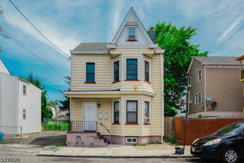 a front view of a house with garage