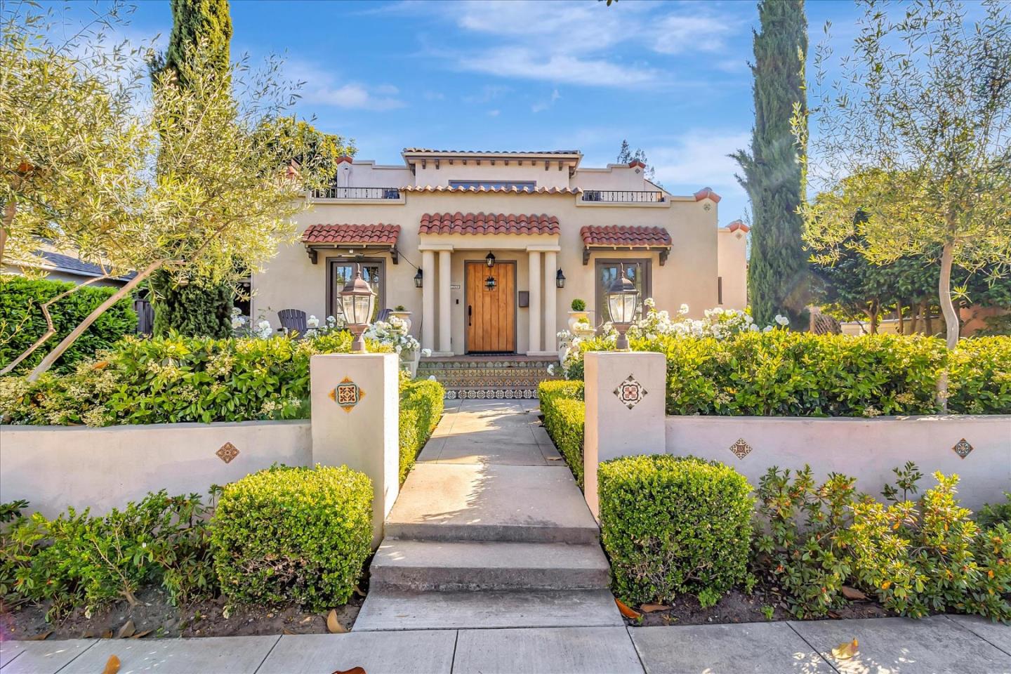 front view of a house with a garden