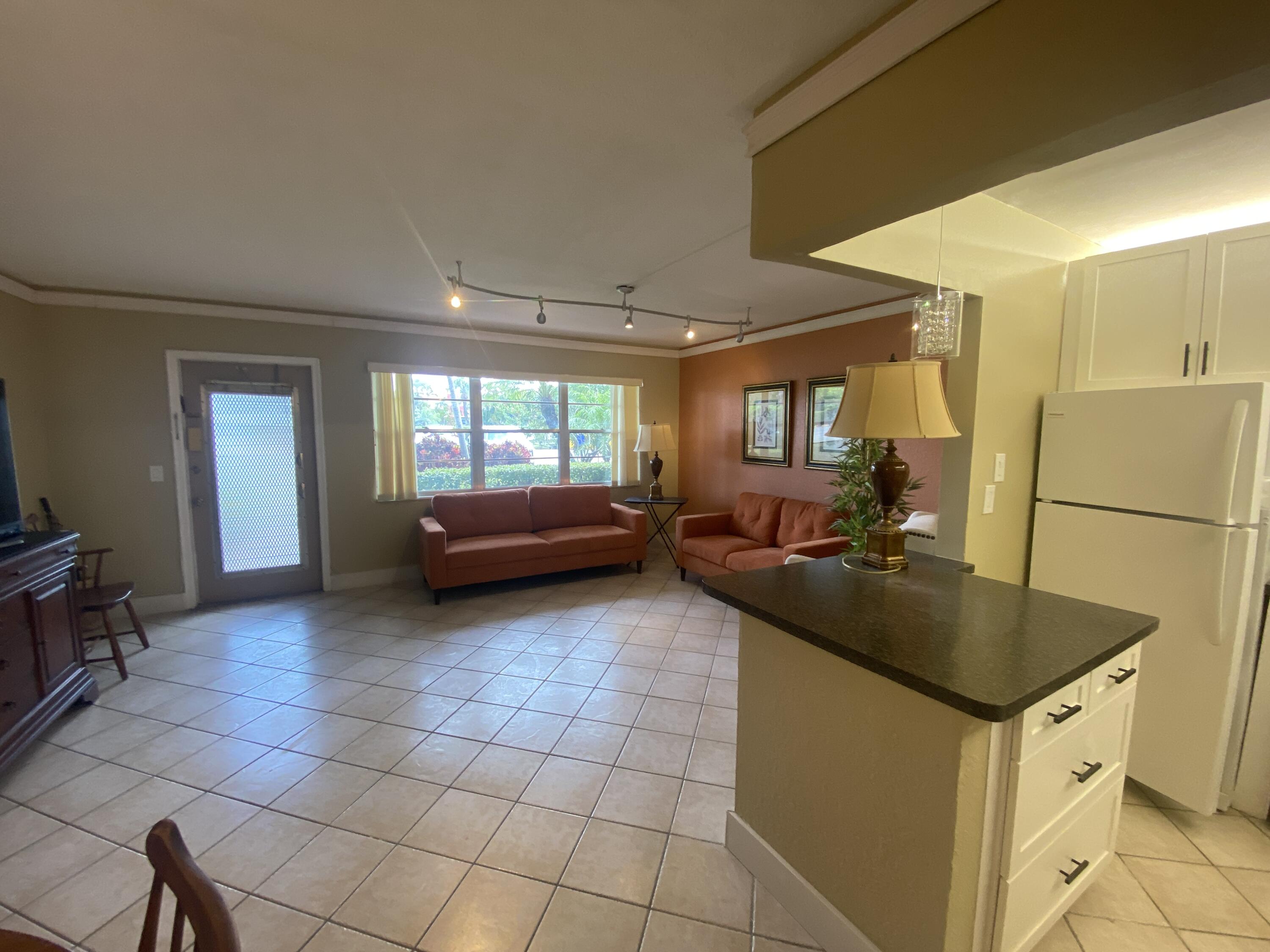 a kitchen with a sink and a stove top oven