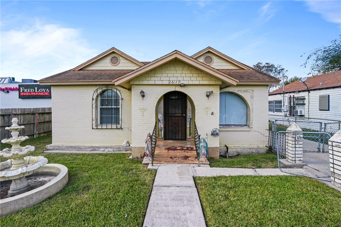 a front view of a house with a yard