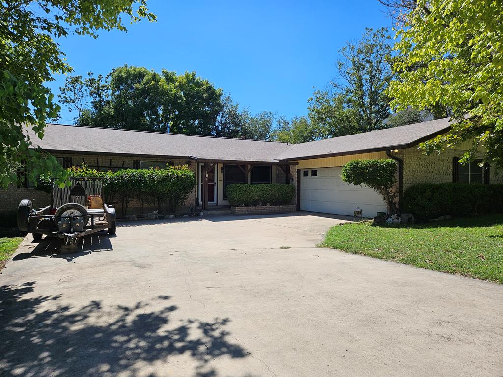 a view of backyard with a patio and garden