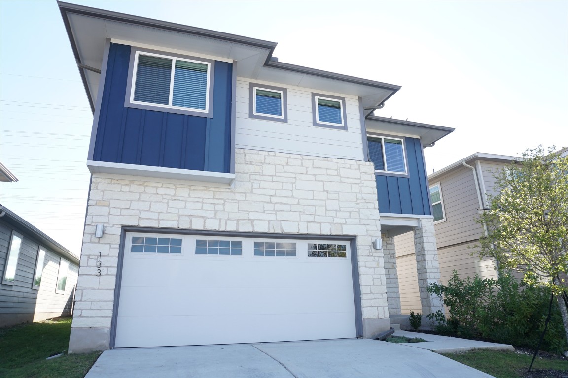 a front view of a house with a garage