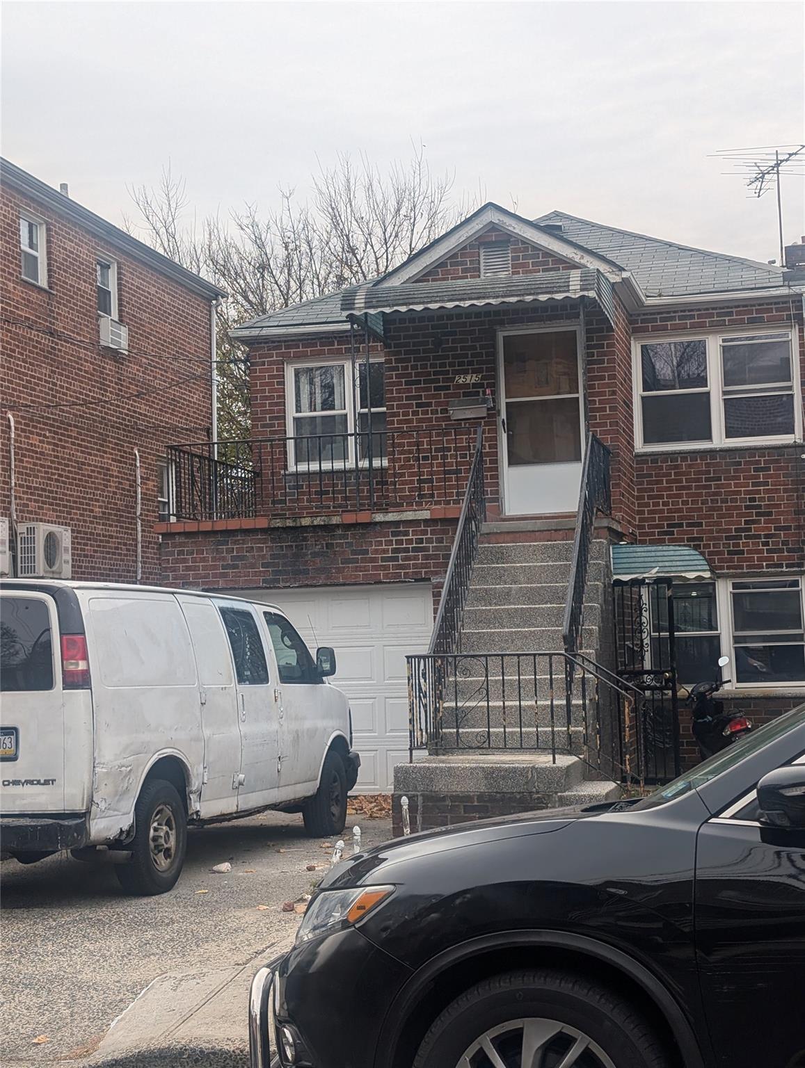 View of front of property featuring a garage