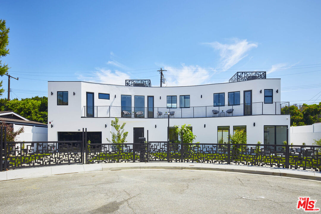 a front view of a building with street view