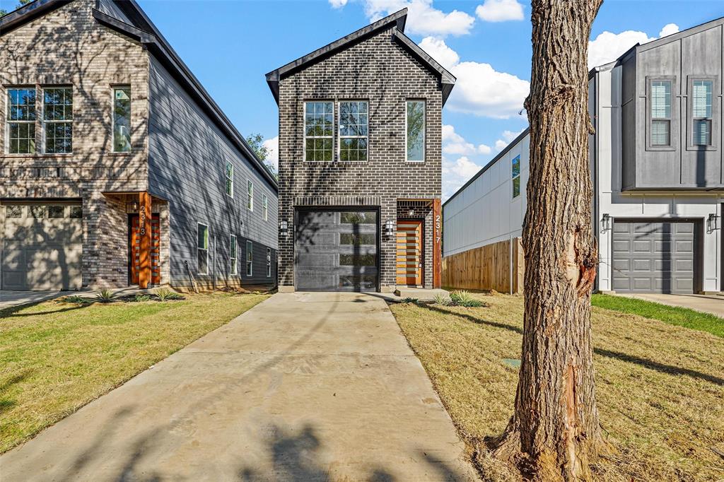 a view of a house with brick walls