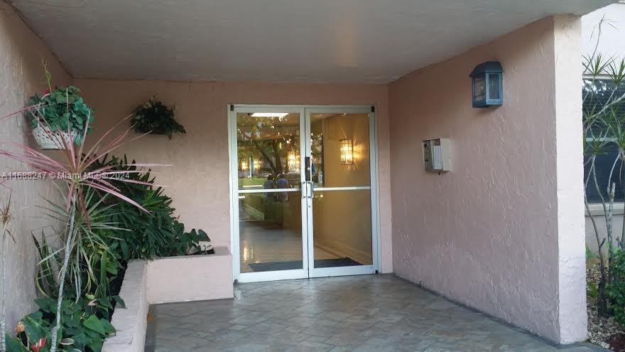 an entryway with a potted plant