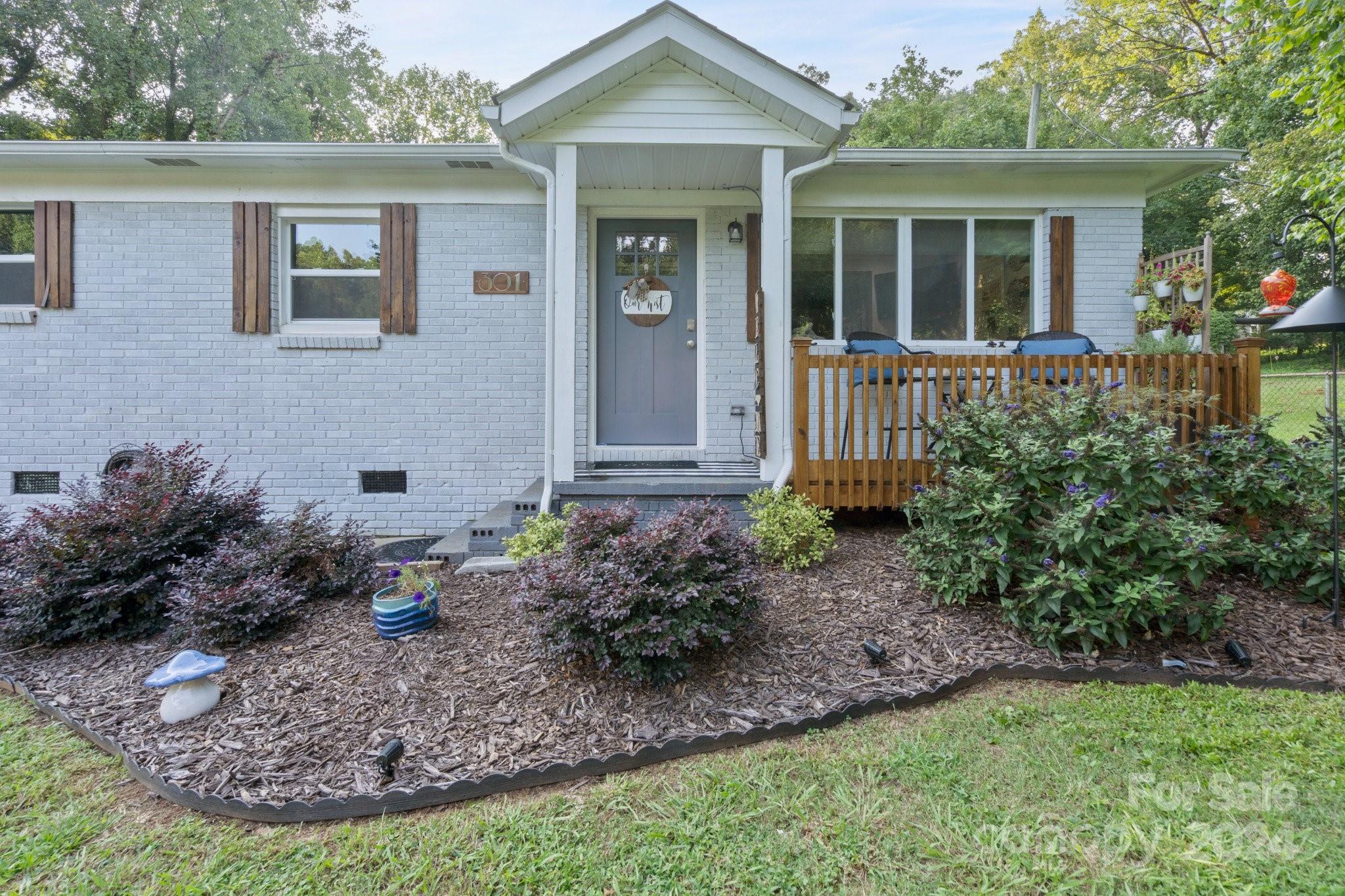 a front view of a house with garden