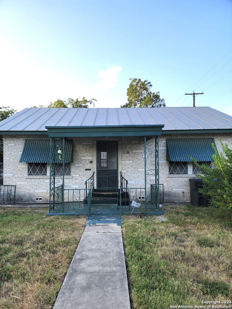 a front view of a house with garden