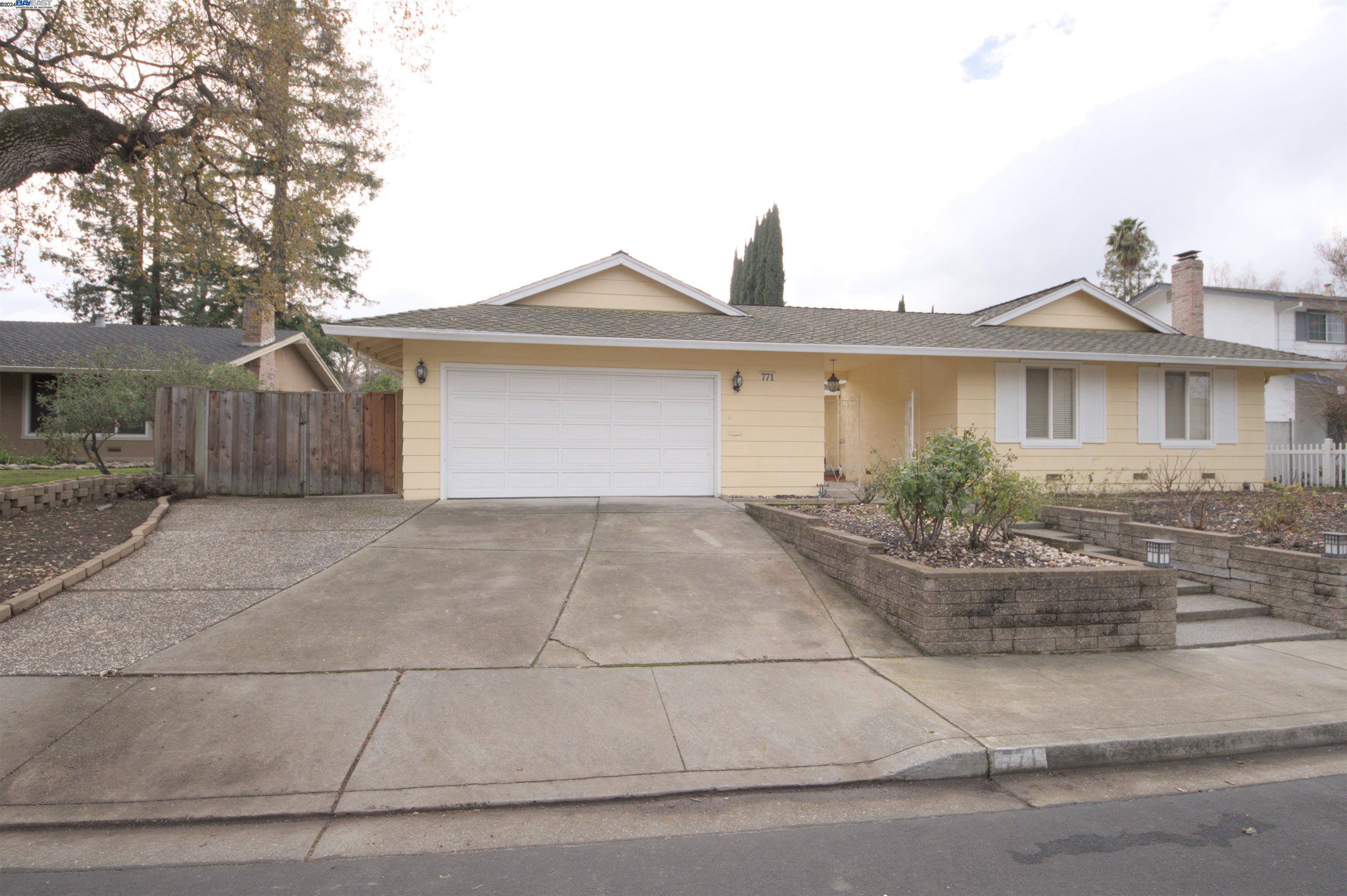 a front view of a house with garage