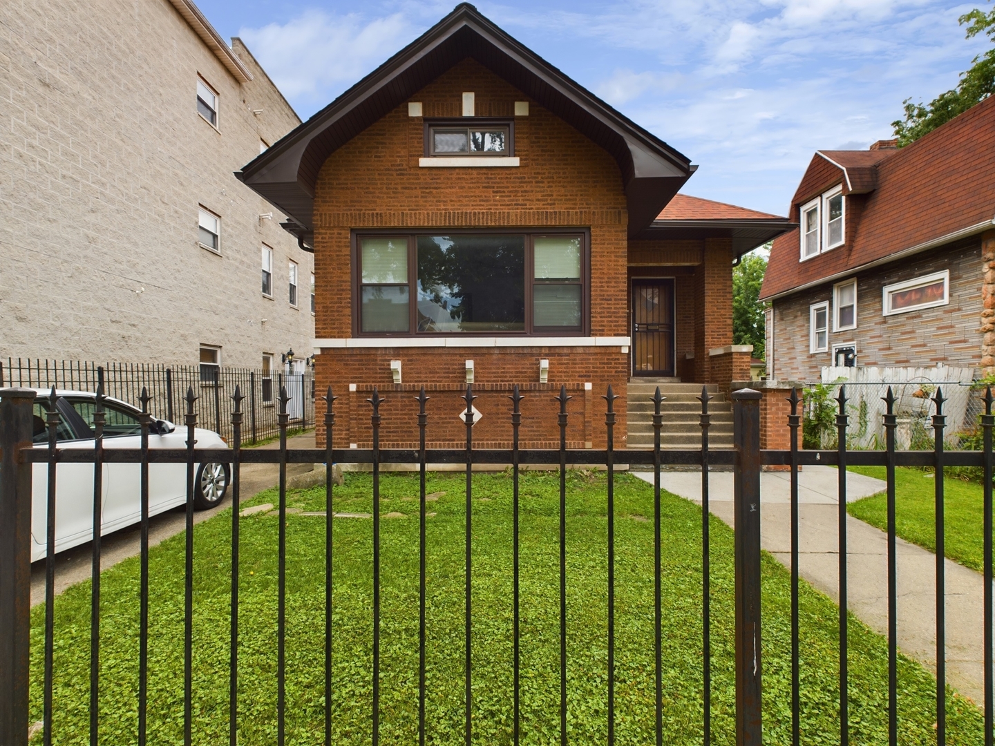 a front view of a house with a yard