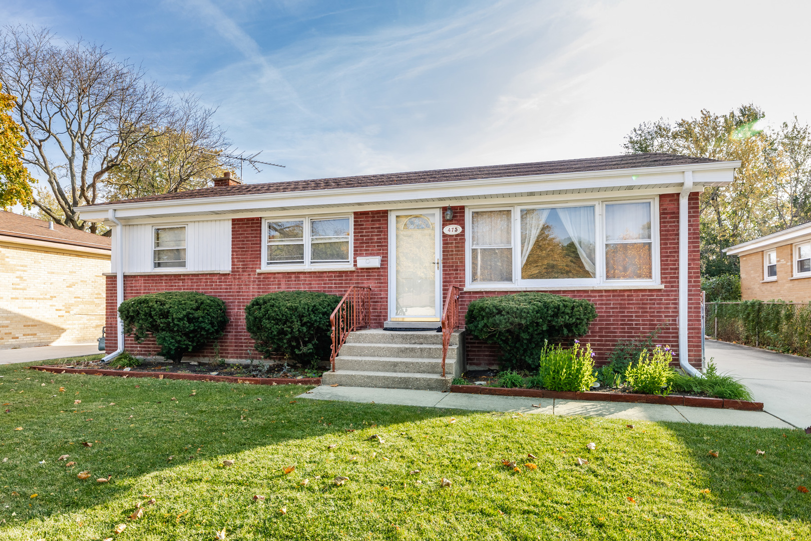 front view of a house with a yard