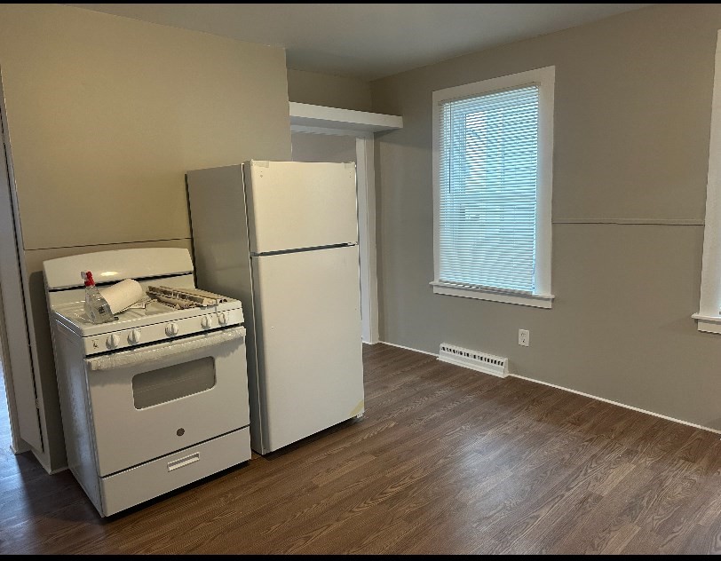 a view of a kitchen with washer and dryer