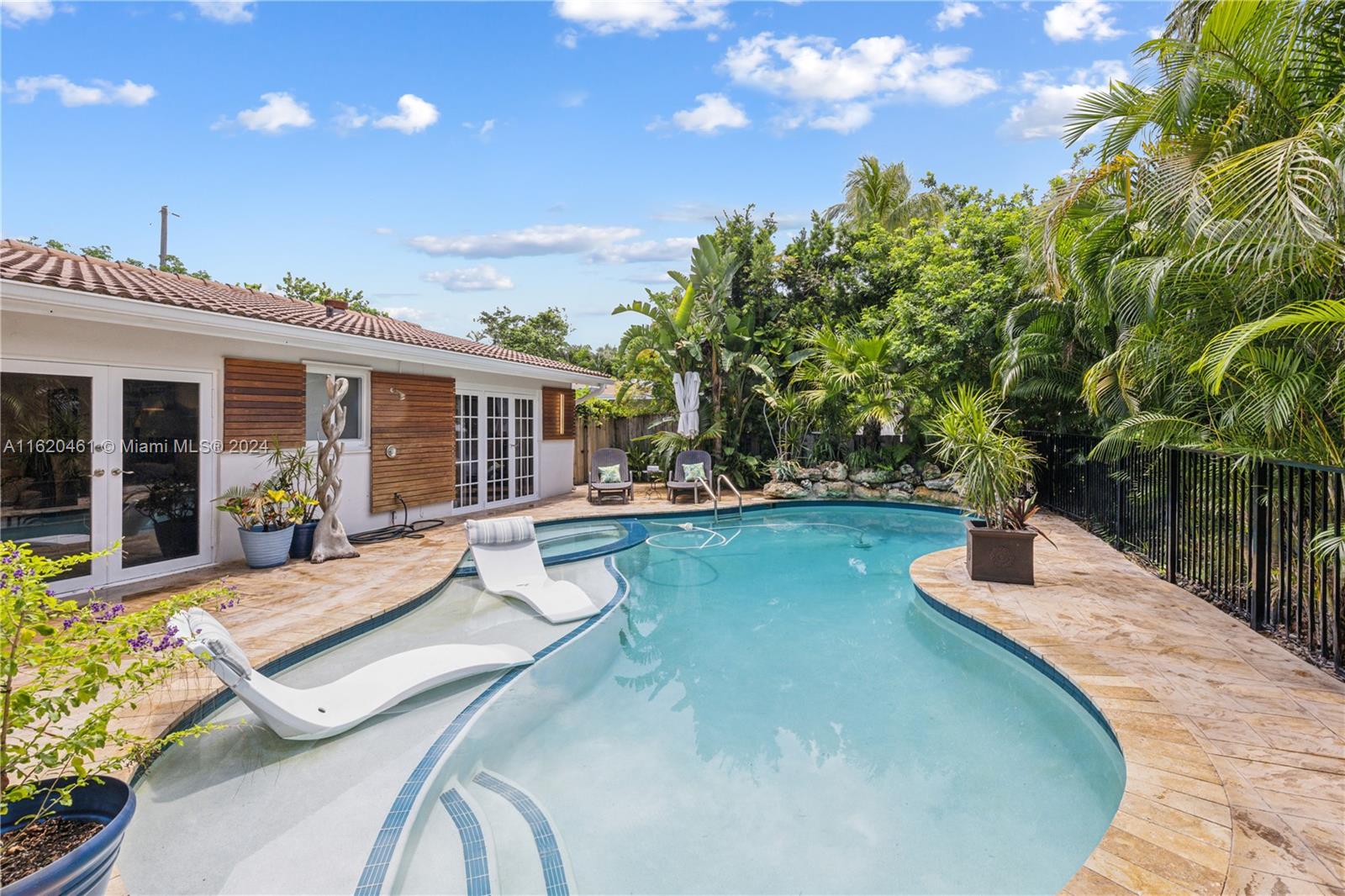 a swimming pool with outdoor seating and yard