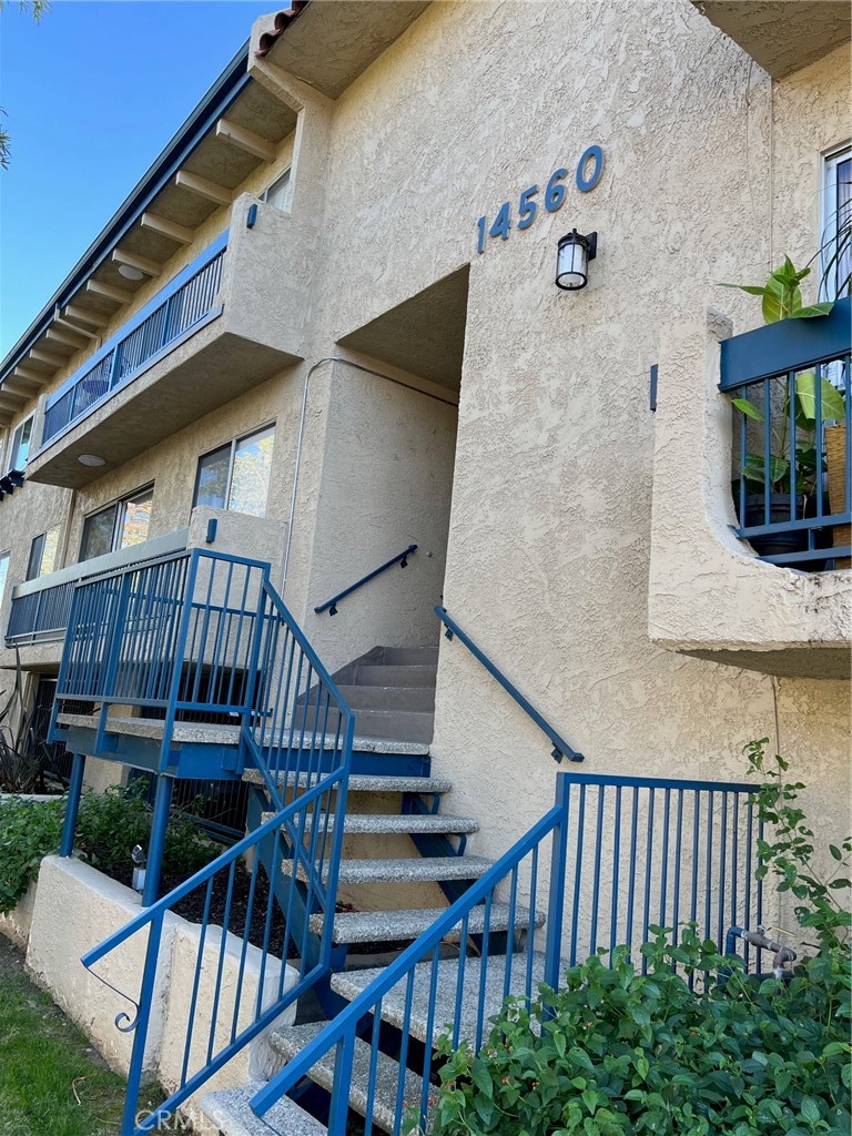 a view of entryway with wooden stairs