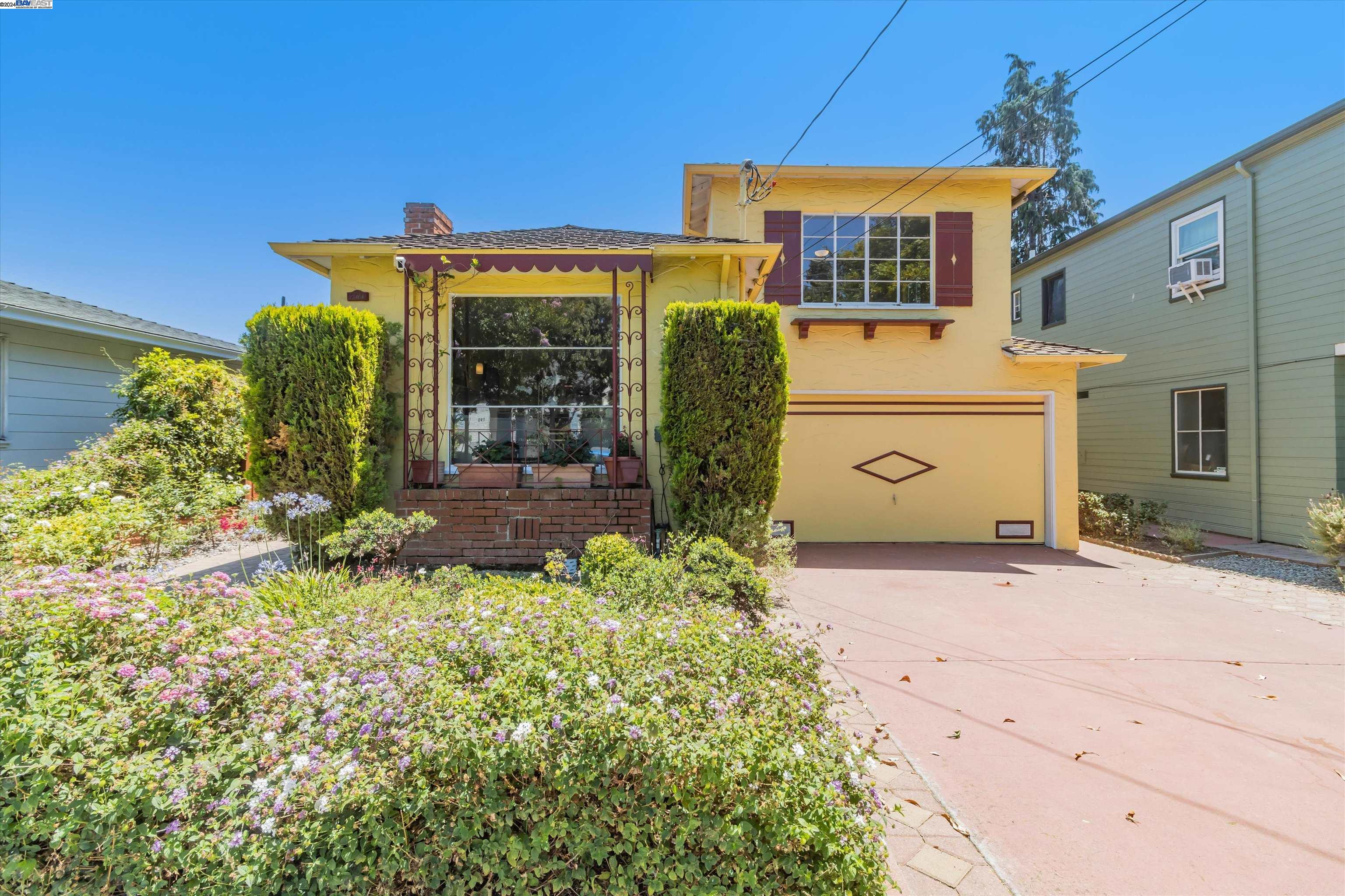 a front view of a house with garden