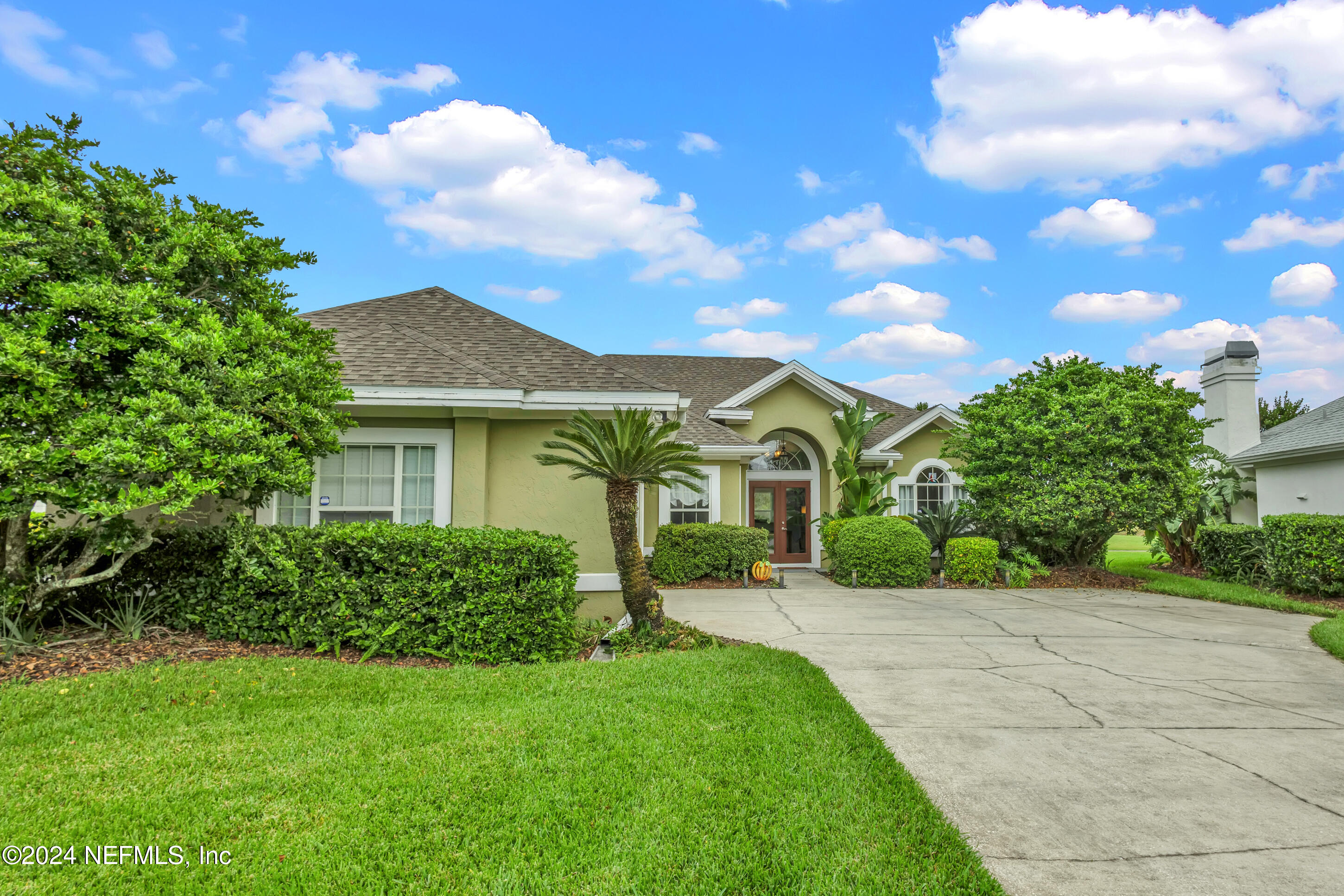 a front view of a house with a yard