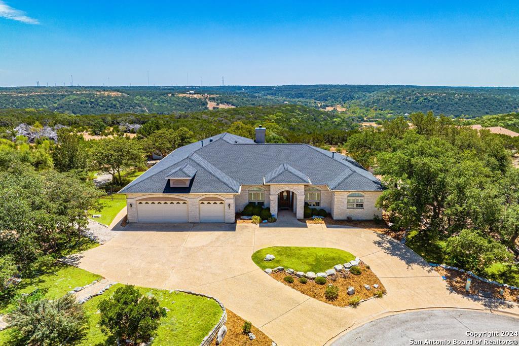 an aerial view of a house with a garden