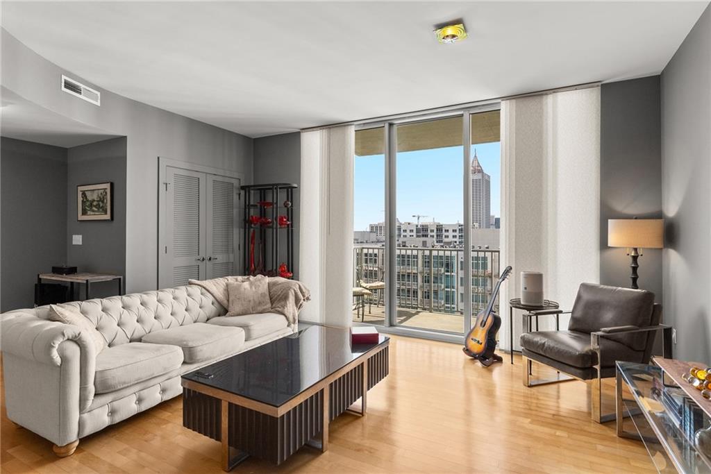 a living room with furniture and a large window