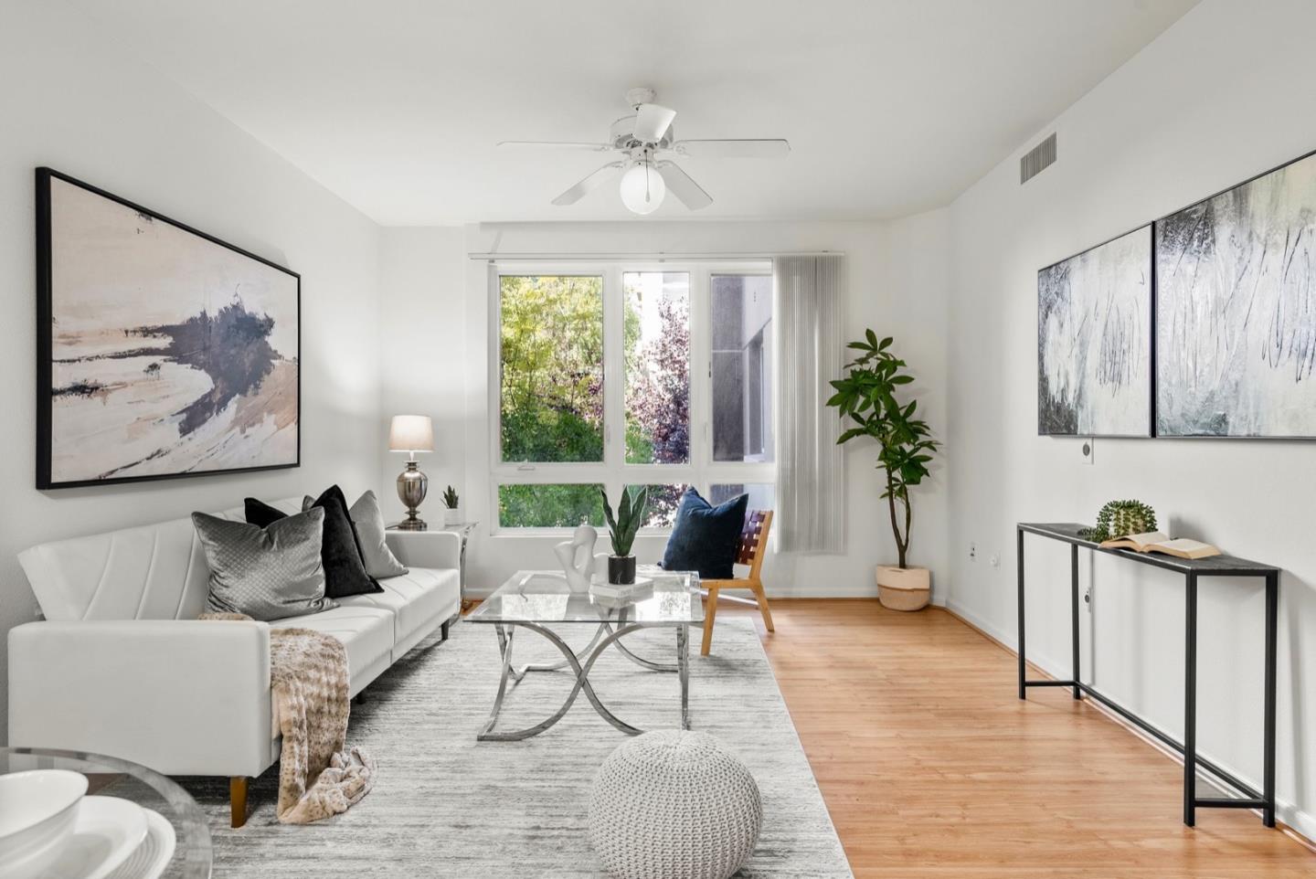 a living room with furniture and a large window