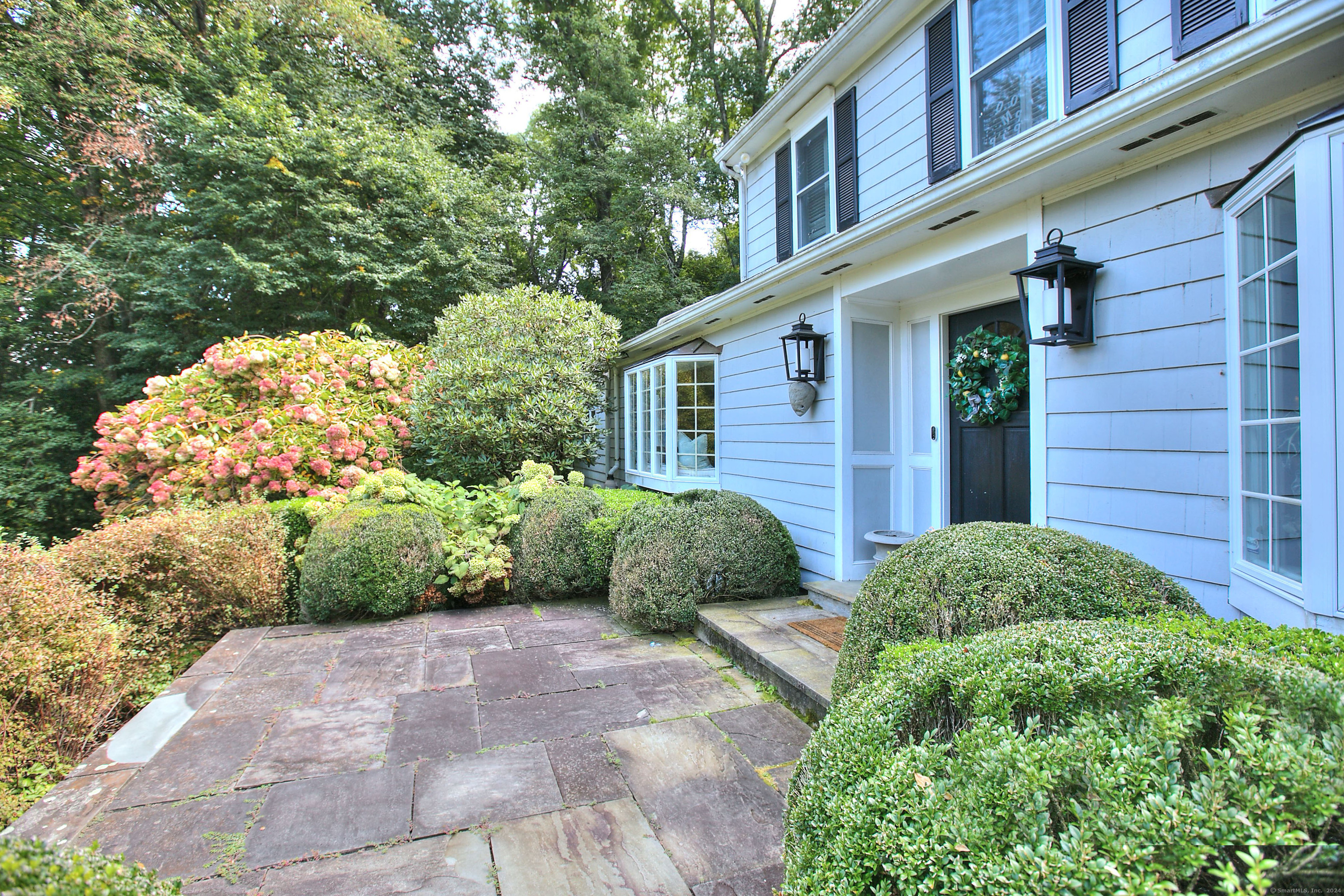 a view of a house with a garden