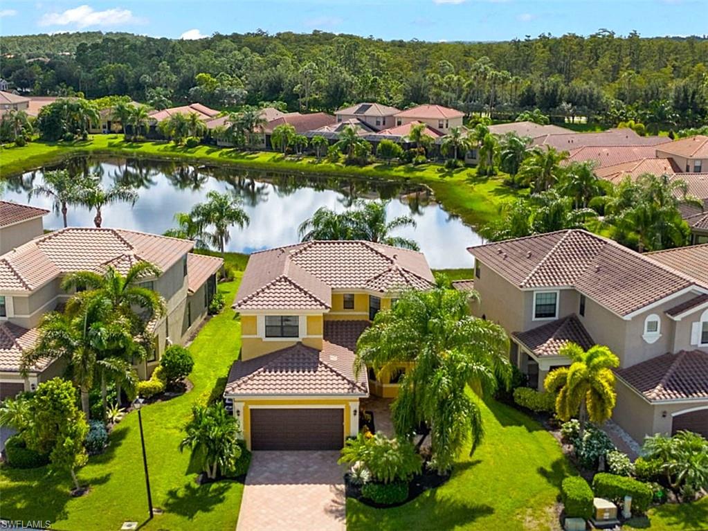 a aerial view of multiple houses with yard