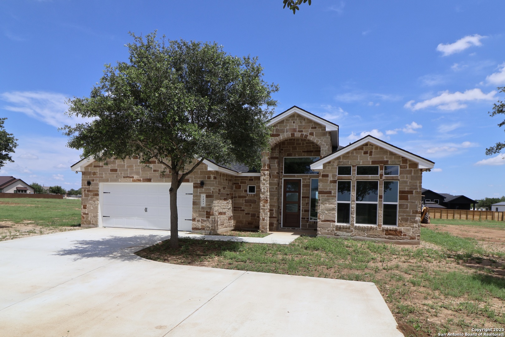 front view of a house with a yard