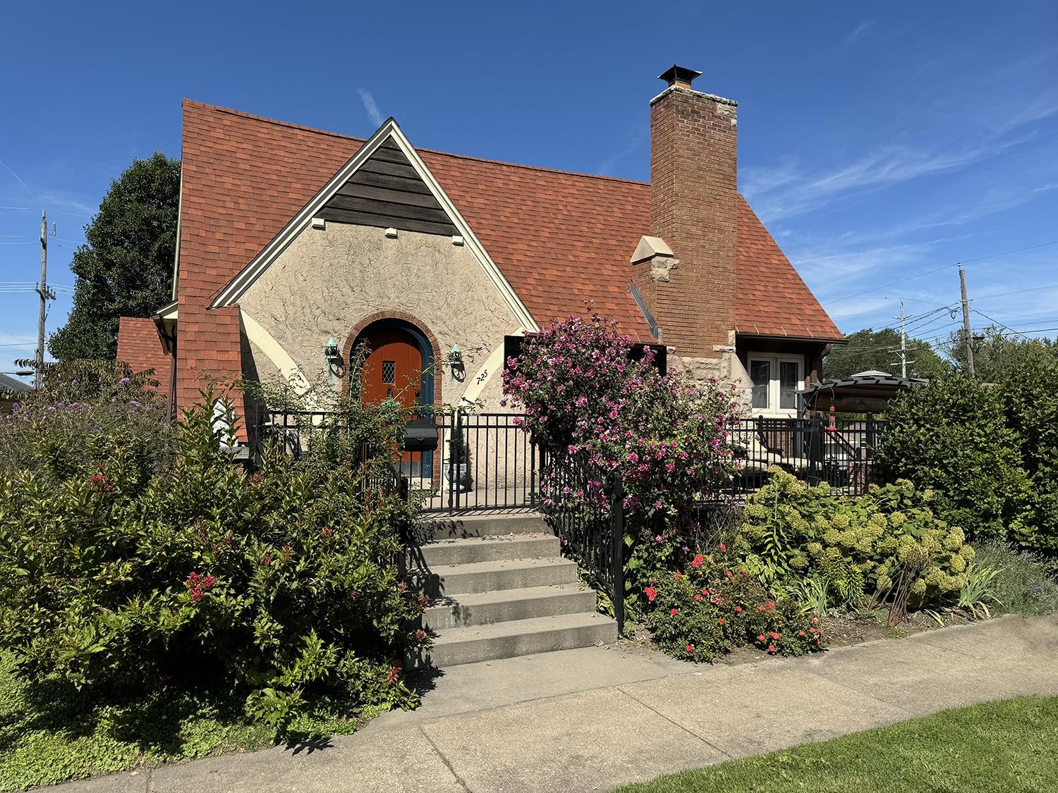 a front view of a house with garden