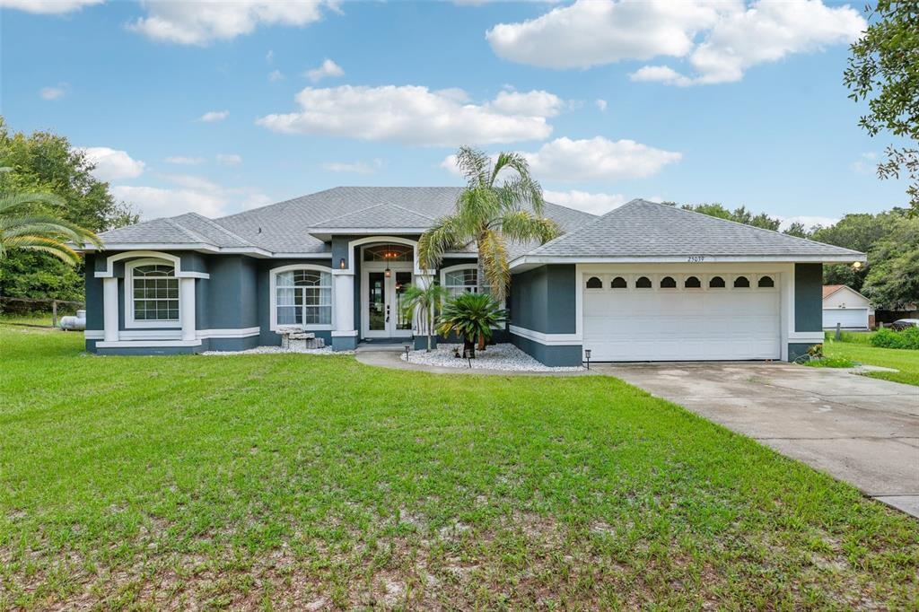 a front view of a house with yard